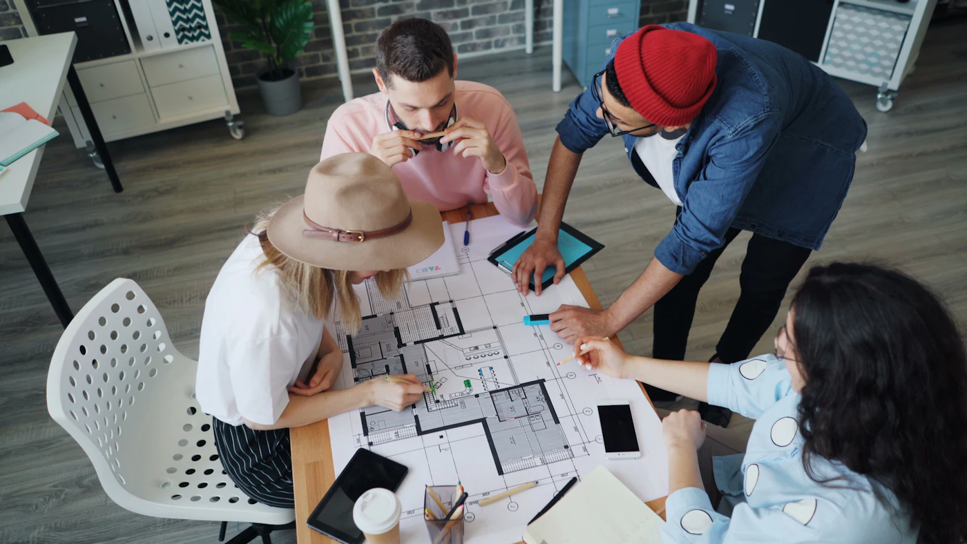 Design team reviewing floor plans