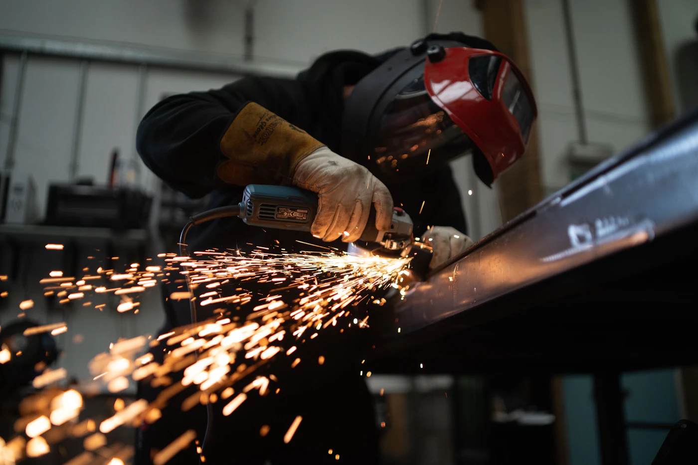 Metal fabrication with sparks from a grinder
